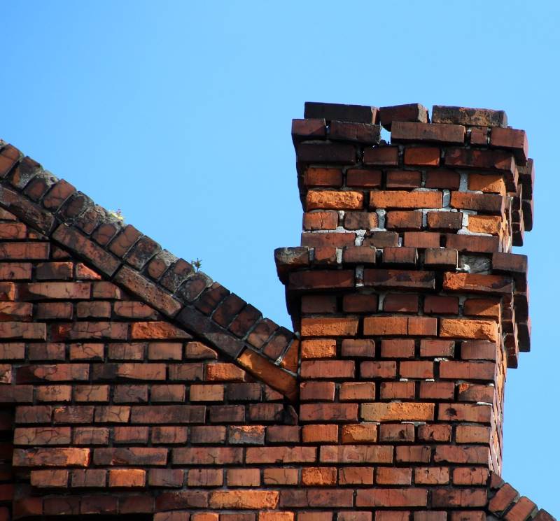 Signs Your Joliet Home Needs a Chimney Inspection Damaged chimney on an Joliet home showing cracks and missing mortar
